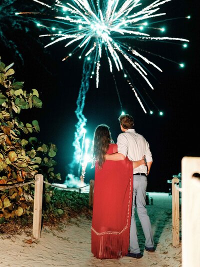 Newlyweds Watching Fireworks on Beach