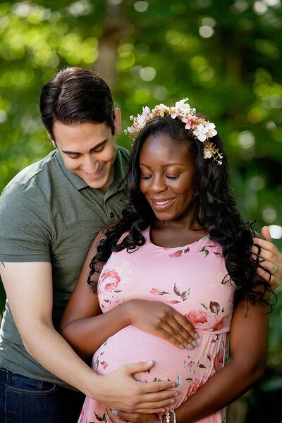 A serene maternity photoshoot in Orlando, florida, showcasing a glowing mother-to-be in a beautiful greenery location. 