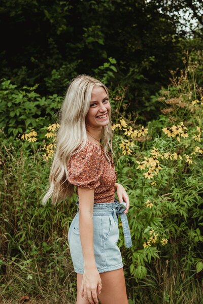 woman smiling and looking over her shoulder