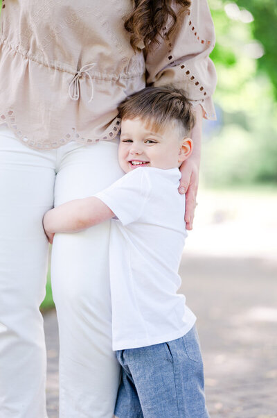 Little boy hugging his mom