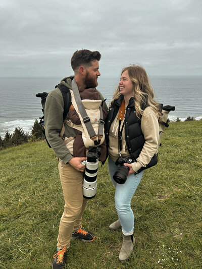 Photographer and videographer looking at each on God's Thumb in Oregon taken by wedding photographers coeur d'Alene Idaho.