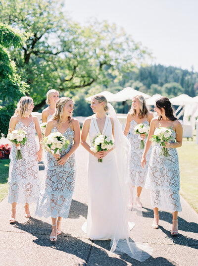 candid photo of bridesmaids walking at waverley country club