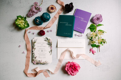 Jewel toned wedding invitation spread