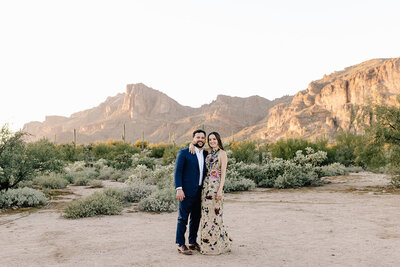 couple posed against Arizona hillside