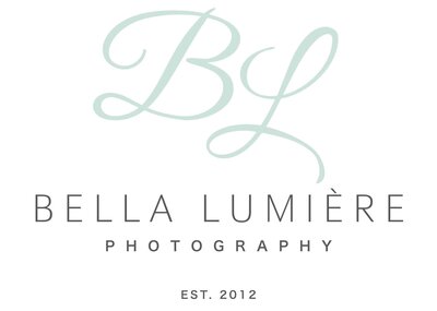 The logo for Bella Lumiere Photography features elegant, cursive initials "BL" in a soft mint color on a white background. Below, "Bella Lumiere Photography" is written in a sleek, modern font with "Est. 2012" beneath, reflecting a sophisticated and professional brand identity. Ideal for North Carolina wedding and portrait photography, emphasizing elegance and artistry.
