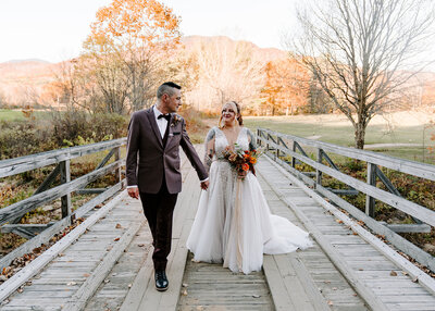 couple walking along bridge