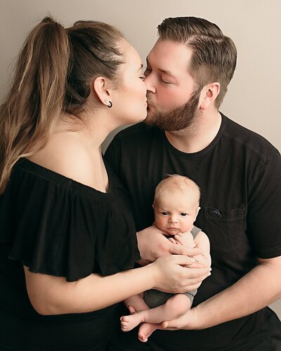 fmaily of four with daughter sucking thumb in family photosession