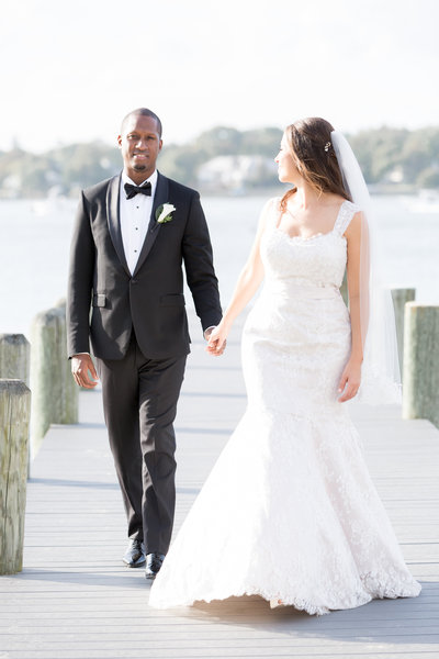 Bride and groom embrace outdoors at Clarks Landing Yacht Club wedding
