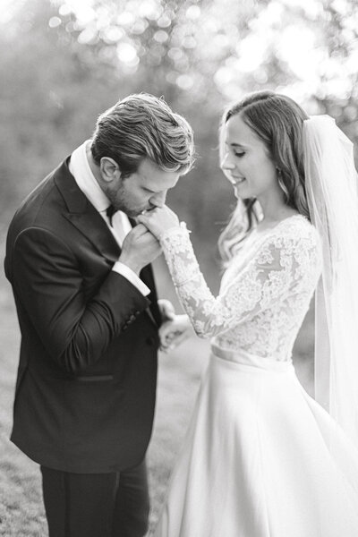 Picture of wedding photographer in Virginia holding camera.