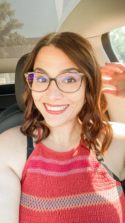 girl with glasses smiling