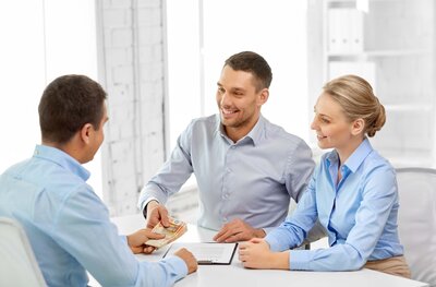 Shaking hands during financial meeting