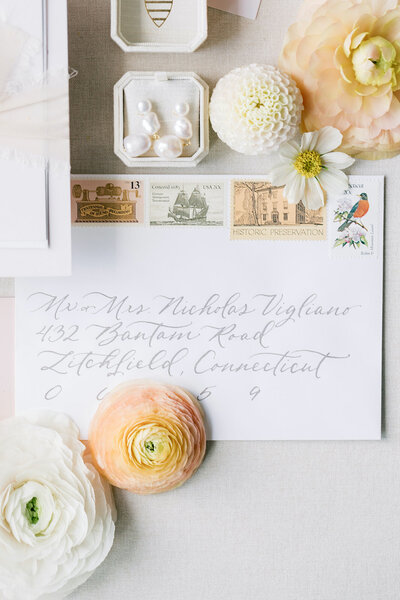 White wedding invitation envelope with calligraphy & vintage postage for Litchfield County, Connecticut wedding