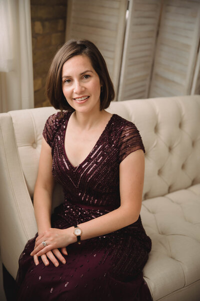 Sarah Weisbrod, Flutist and Teaching Artist, Sitting on a Couch