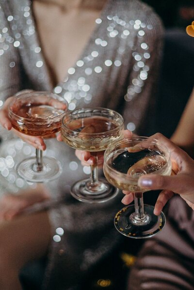 Women Clinking Cocktail Glasses Together