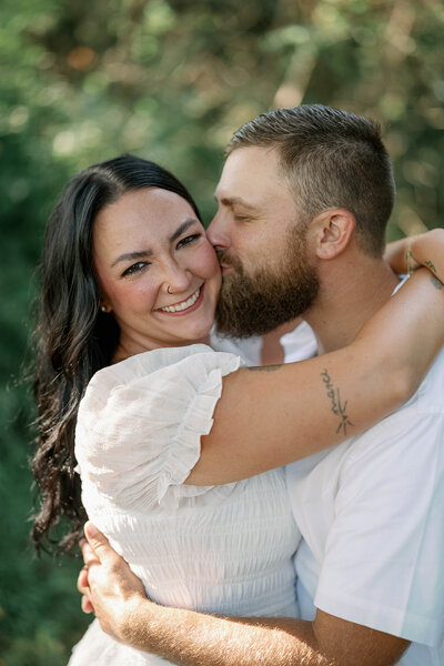 The bride and groom share a playful and joyful moment running and laughing together at the Morris Estate venue, capturing their happiness and the lively spirit of their special day