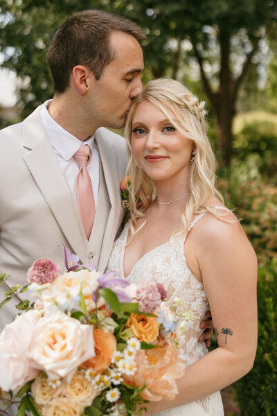 Portrait of groom kissing bride at Nashville wedding