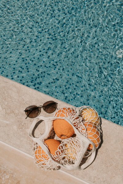 By a pool bathed in light, reflecting the journey of self-discovery and subconscious healing