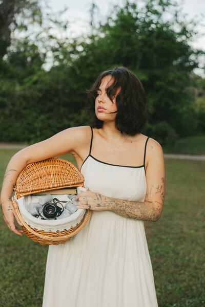 photo of girl in field with horses