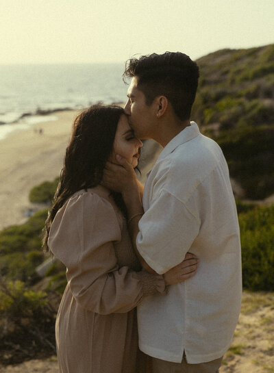 Thuy Tran Photos captured this sweet engagement for Tiffany and John at Crystal Cove.