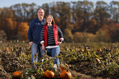 couple fall foliage pumpkin patch