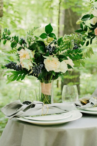 Garden-flower-wedding-bouquet-set-on-decorated-table