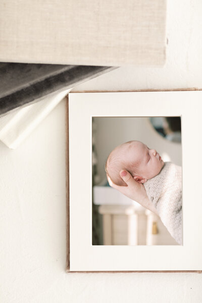 Flatlay photo of luxury matted albums offered by Savannah Family Photographer Courtney Cronin