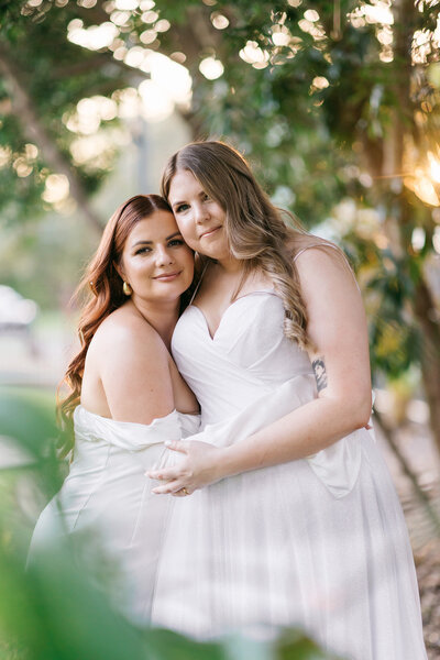 Same-sex couple holding hands during an intimate wedding moment — inclusive and heartfelt Brisbane wedding photographer.