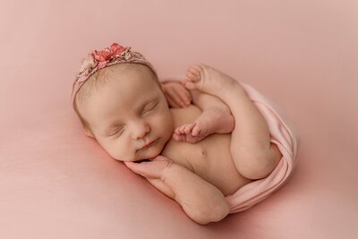Baby girl on pink backdrop