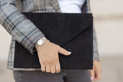 DC Event Consultant in gray plaid blazer with watch and jewelry