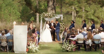 bride and groom exchanging vows during spring ceremony