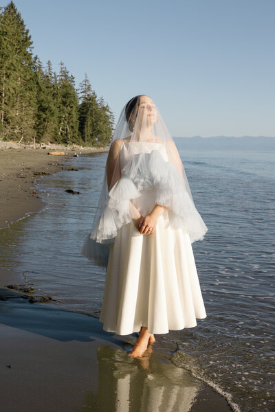Bride and Groom overlook the three sisters mountain view in Canmore Alberta