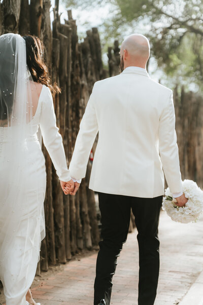 Bride & Groom walking around the Santa Fe Plaza