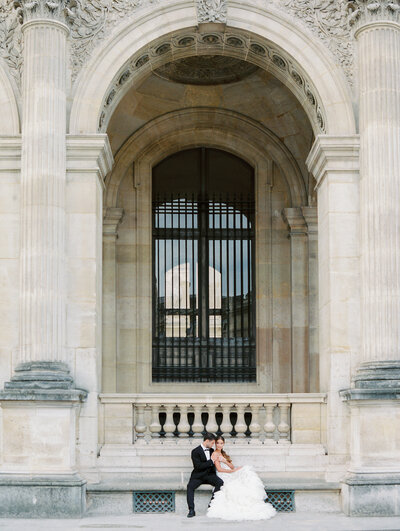 Bride and groom at the Louvre in Paris, France.