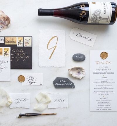Flat lay photography of wedding calligraphy items