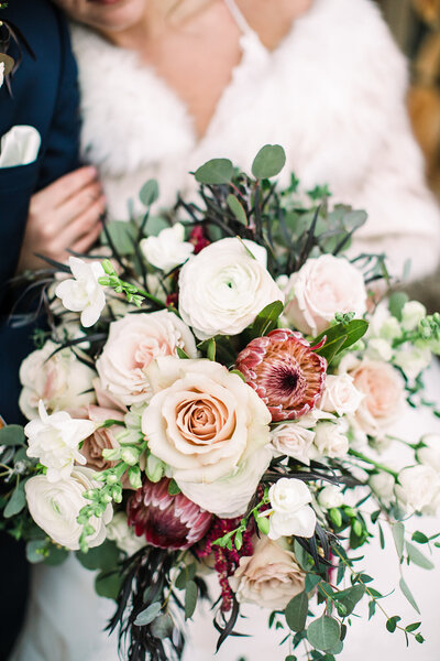 Macro photo of ivory and burgundy bridal bouquet