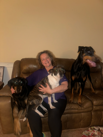 Mary the receptionist with her three dogs