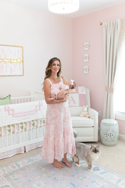 Mom holding baby for an in-home newborn session