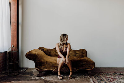 woman posing on a couch