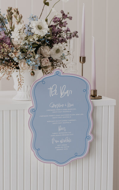 Bar signage for wedding in pastel blue by State of Elliott