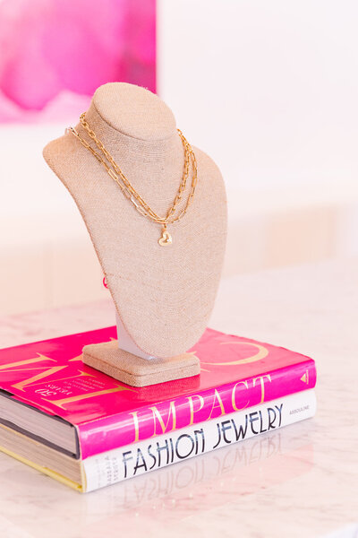 details of necklaces and fashion books