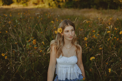 girl standing in wildflower field in Oregon