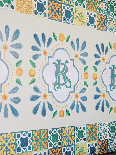 Sicilian themed blue and orange wedding monogram display