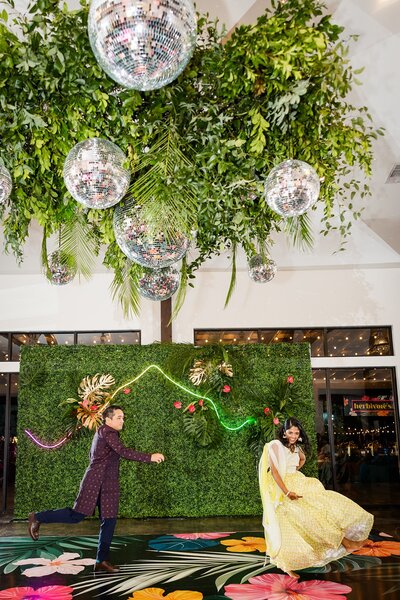 Couple dancing under disco balls at hill country wedding venue