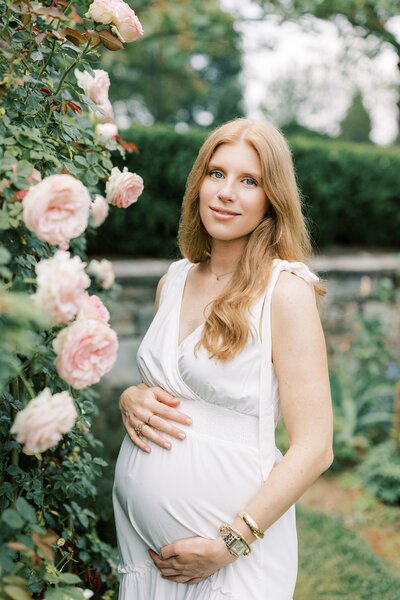 outdoor maternity portrait with flowers by Philadelphia Maternity Photographer