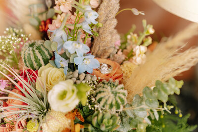 Ring sitting on flower in bouquet