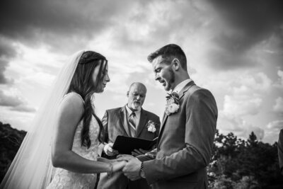 Bride and groom praying and crying at a Blue Mountain Vineyards wedding ceremony