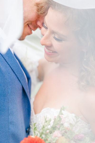 bright light and airy wedding photo of bride and groom