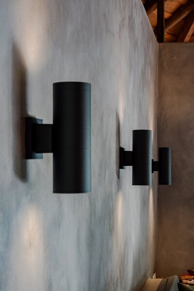Cylinder lights on grey wall