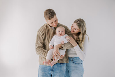 A family photography session in Richmond VA of a couple with their baby.
