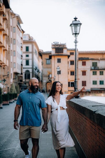 Tourist couple walking around a european city on a perfectly curated vacation